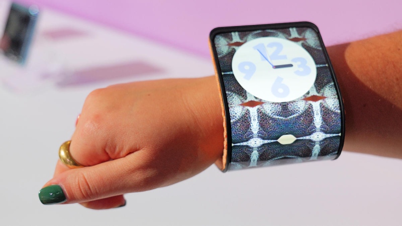 A Motorola slap bracelet-style smartphone is designed to wrap around your wrist like a flexible smartphone